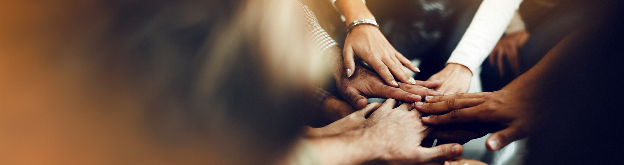 People putting hands together as a team